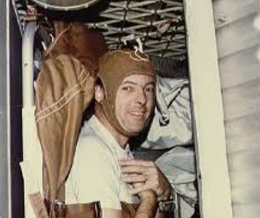 Astronaut Joseph Kerwin strapped into sleep restraint aboard Skylab