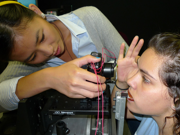 A NASA researcher is setting up a Visuomotor Control Lab Oculometrics study