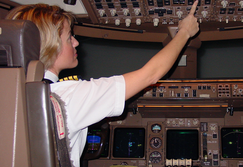 A test pilot is setting up a flight simulator for and Emergency and Abnormal Situations (EAS) Research project