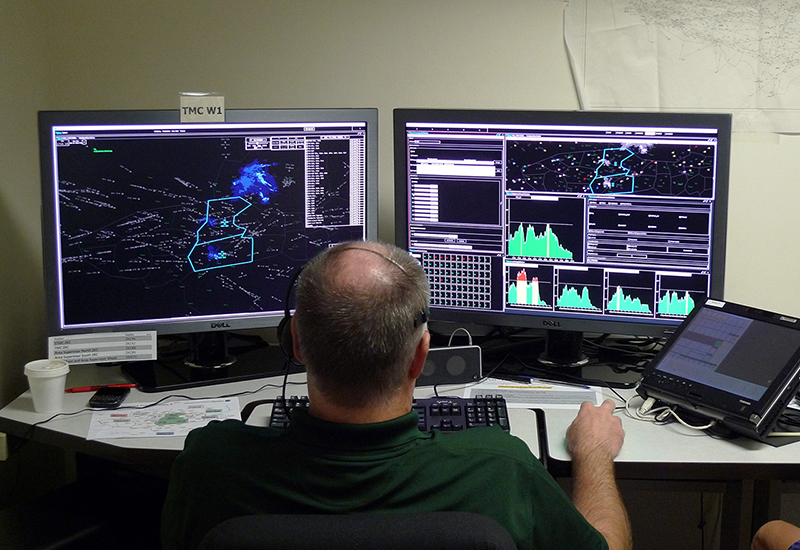 A controller is monitoring traffic in an Airspace Operations Laboratory (AOL) research study