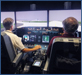 Test pilots are using a flight simulator in the Human-Centered Systems Laboratory [click to view image galleries]